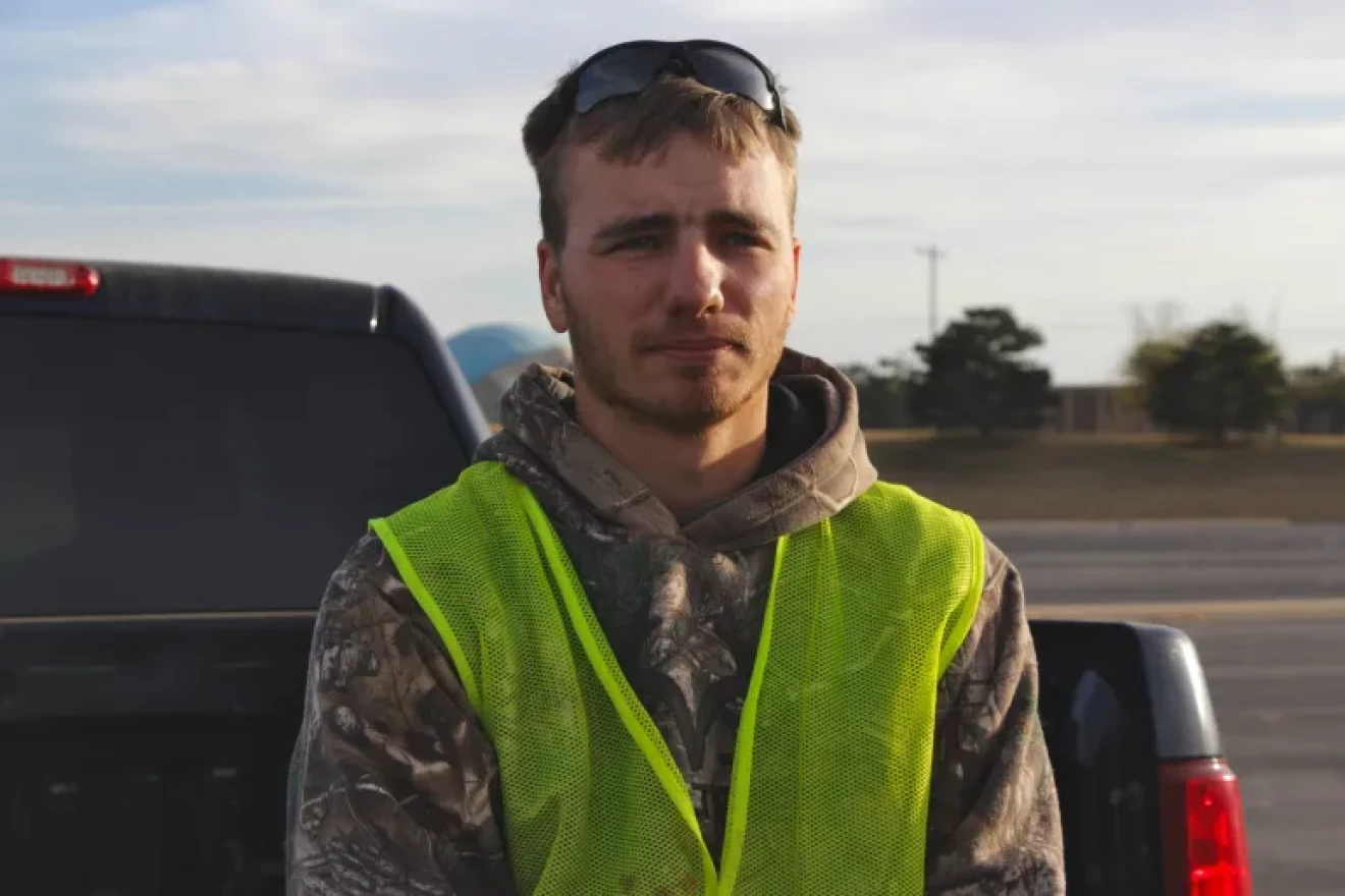 Kenneth Manning, an electrician’s apprentice and former correctional officer, leans on the tailgate of his Chevy Silverado after a day working inside Oklahoma City Zoo. Manning was a correctional officer at age 20 and one of his many jobs was to monitor the activity of incarcerated Oklahomans.